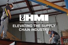 Hoist safety. two men attached in safety harnesses on hoist equipment