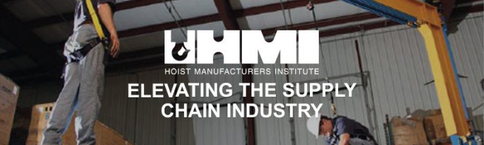 Hoist safety. two men attached in safety harnesses on hoist equipment